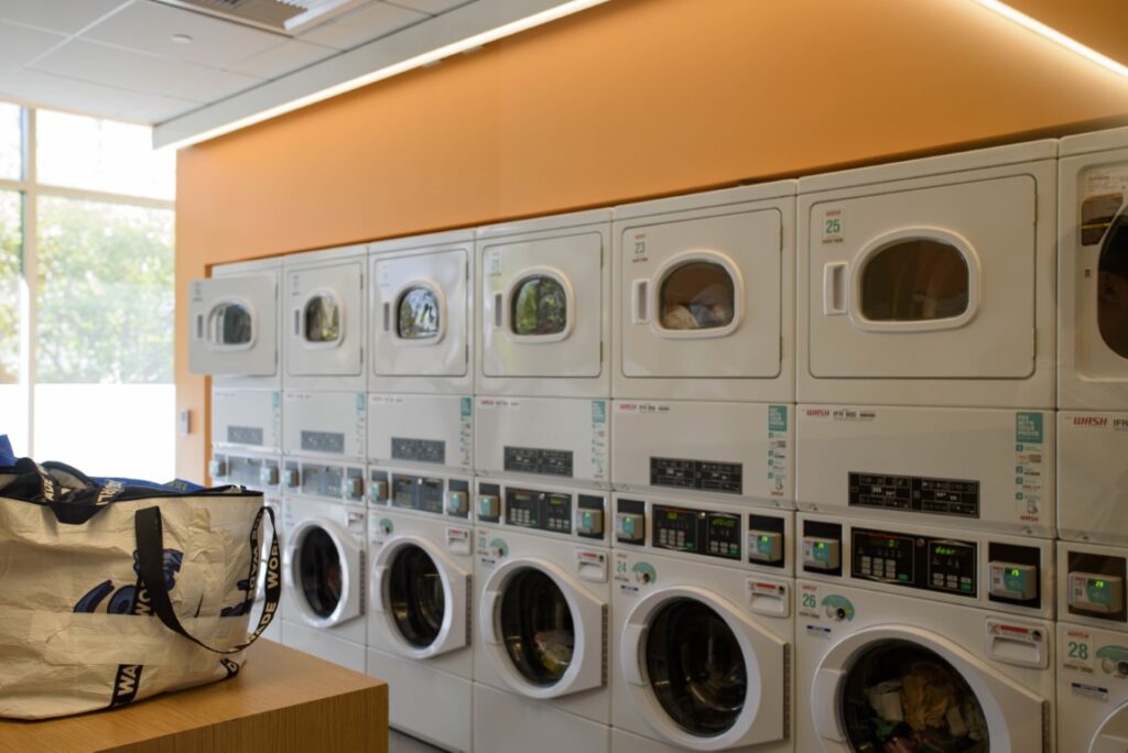 UCLA laundry machines inside the Gayley Heights university apartment building are pictured. Students recently complained about wait times and the washing efficiency of UCLA Housing’s laundry facilities. (Renee Rubanowitz/Daily Bruin)