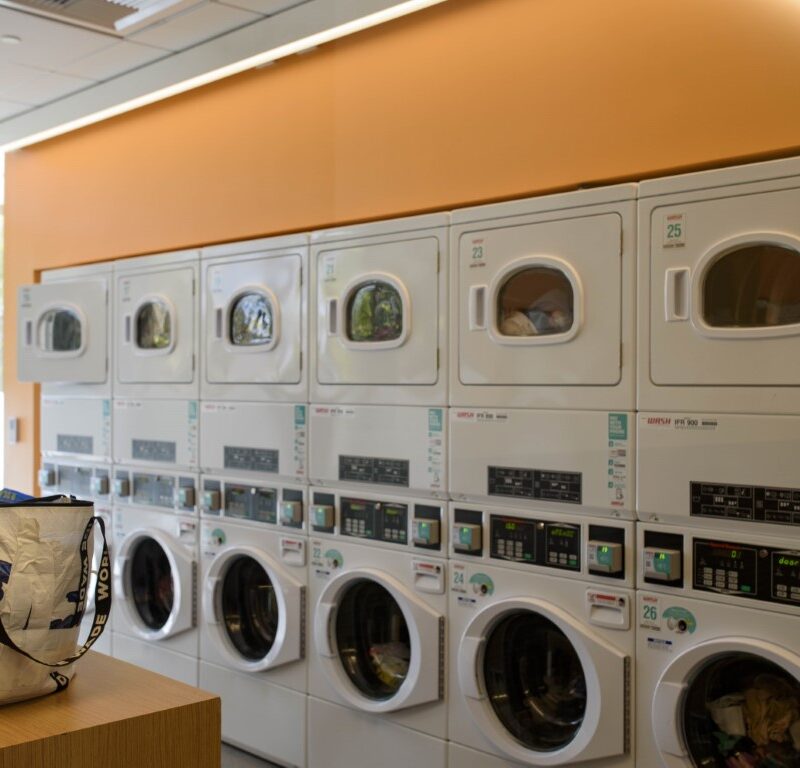 UCLA laundry machines inside the Gayley Heights university apartment building are pictured. Students recently complained about wait times and the washing efficiency of UCLA Housing’s laundry facilities. (Renee Rubanowitz/Daily Bruin)